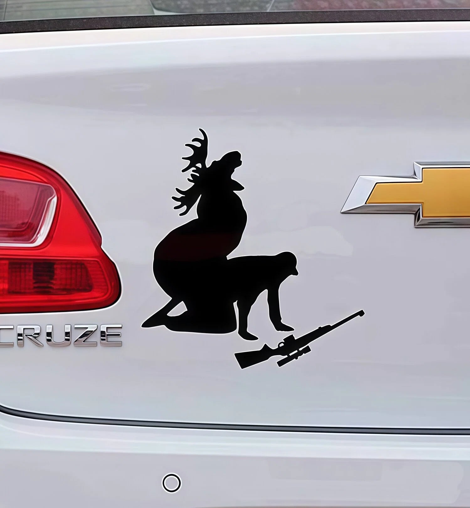 Xalvoria black silhouette hunting deer and rifle decal applied on a car tailgate, showcasing outdoor hunting culture and rugged vehicle personalization.