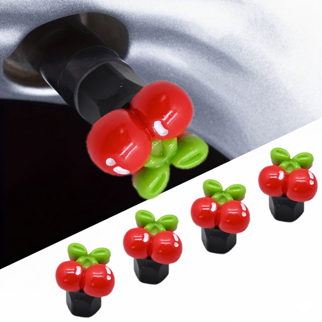 Red cherry-shaped valve stem caps shown installed on a tire valve, with a 4-pack set displaying the cute fruit design for cars and bikes.