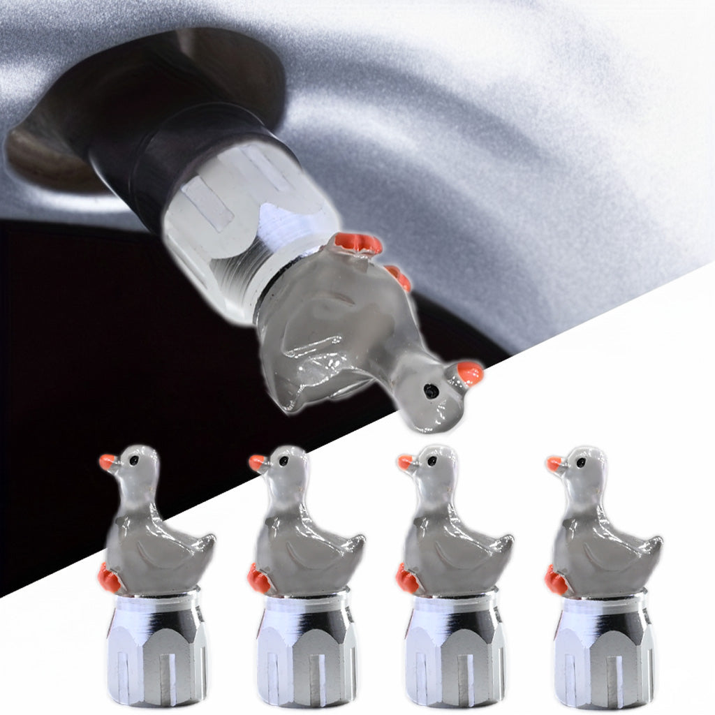 Grey Goose valve stem cap installed on tire valve, cute grey goose design decorative tire accessory in a 4-pack