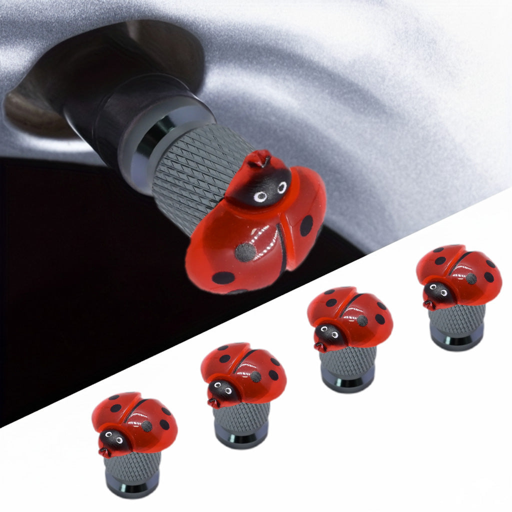 Ladybug valve stem caps 4-pack with car tire installation close-up – Xalvoria