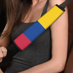 Xalvoria Colombia flag seat belt shoulder pad installed on a car seat belt, showing comfortable shoulder placement and soft padded fabric during driving.