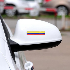 Xalvoria Colombian flag strip decal applied to a car side mirror for a personalized and colorful detail.