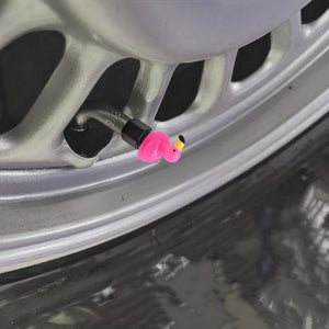 Xalvoria pink flamingo valve stem cap mounted on car wheel valve stem showing decorative topper