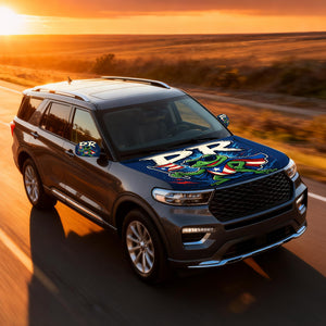 Xalvoria PR frog superhero hood cover featured on an SUV driving on a highway at sunset