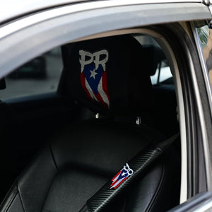 Xalvoria PR seatbelt cover installed on the driver seat, carbon-fiber texture with embroidered PR logo