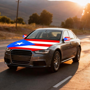Xalvoria Puerto Rico flag car hood cover displayed on a sedan driving at sunset.