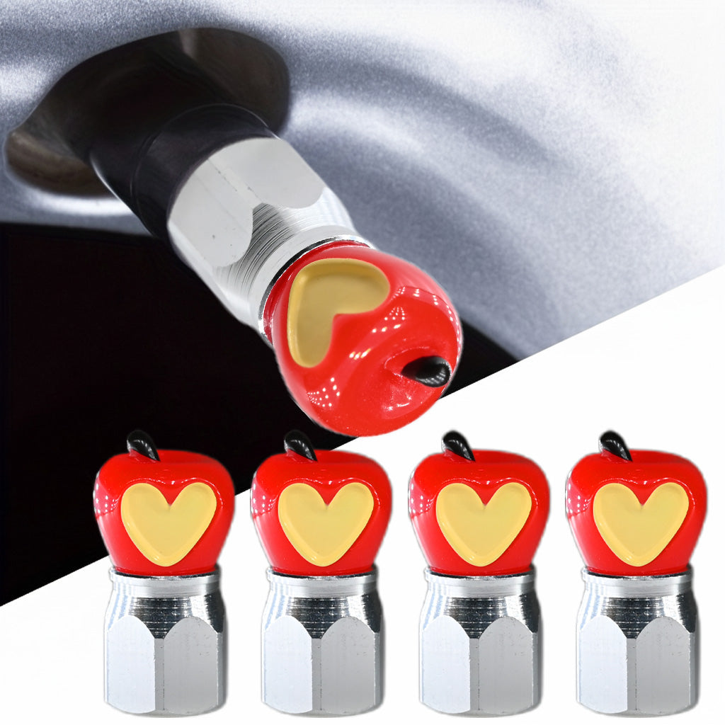 Xalvoria red apple core valve stem caps 4-pack installed on a tire valve with resin apple-shaped toppers.