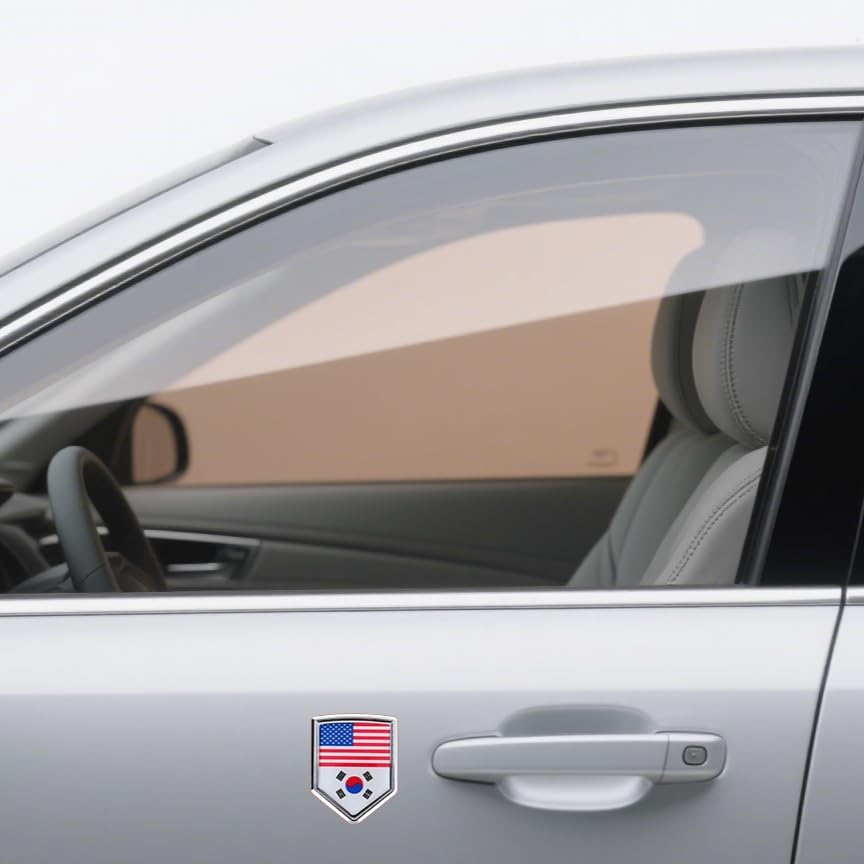 Xalvoria dual flag emblem sticker with United States and South Korea flags applied on a car door panel below the window, shield-shaped chrome-style badge shown in a real vehicle exterior scene
