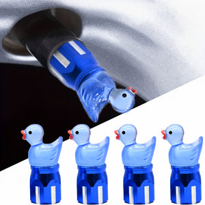 Blue duck-shaped valve stem caps shown on a car wheel, featuring a cute 4-pack design for cars, bikes, and motorcycles.