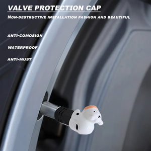 Cute cow valve stem cap installed on a car wheel, showing waterproof and anti-corrosion protection with a decorative ceramic design.