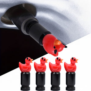 Devil duck valve stem caps 4-pack with close-up installation on a car tire valve – Xalvoria