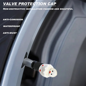 Close-up of the hatching chick valve stem cap installed on a car wheel, showing waterproof and anti-corrosion features.
