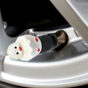 Hatching duck valve stem cap close-up on a car tire valve – Xalvoria