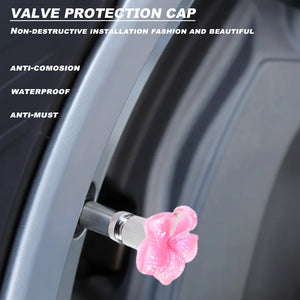 Pink plumeria valve stem cap installed on a car tire valve with waterproof and anti-corrosion protection features – Xalvoria