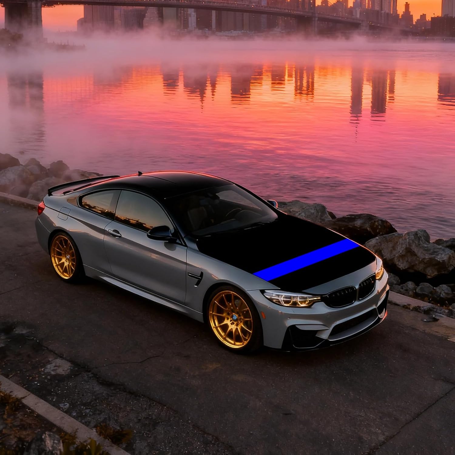 Thin Blue Line hood cover on a sports coupe parked by lakeside at dusk, highlighting bold blue stripe on black cover.