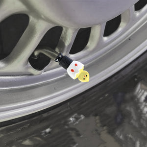Xalvoria Black Base Yellow Eggshell Chicken valve stem cap mounted on a car wheel valve stem