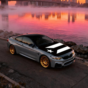 Xalvoria black and white Puerto Rico flag car hood cover displayed on coupe parked by lakeside at sunrise