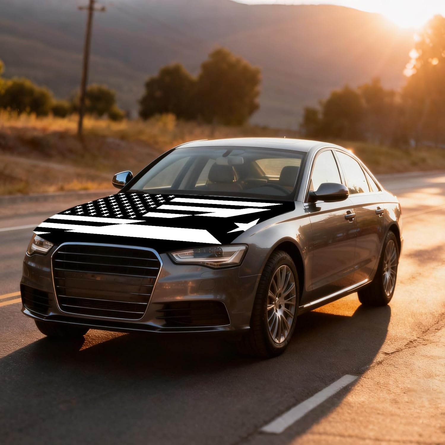 Xalvoria black and white USA Puerto Rico flag car hood cover featured on a sedan at golden hour