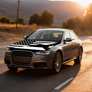 Xalvoria black and white USA Puerto Rico flag car hood cover featured on a sedan at golden hour
