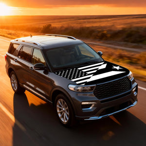 Xalvoria black and white USA Puerto Rico flag hood cover showcased on an SUV driving at sunset