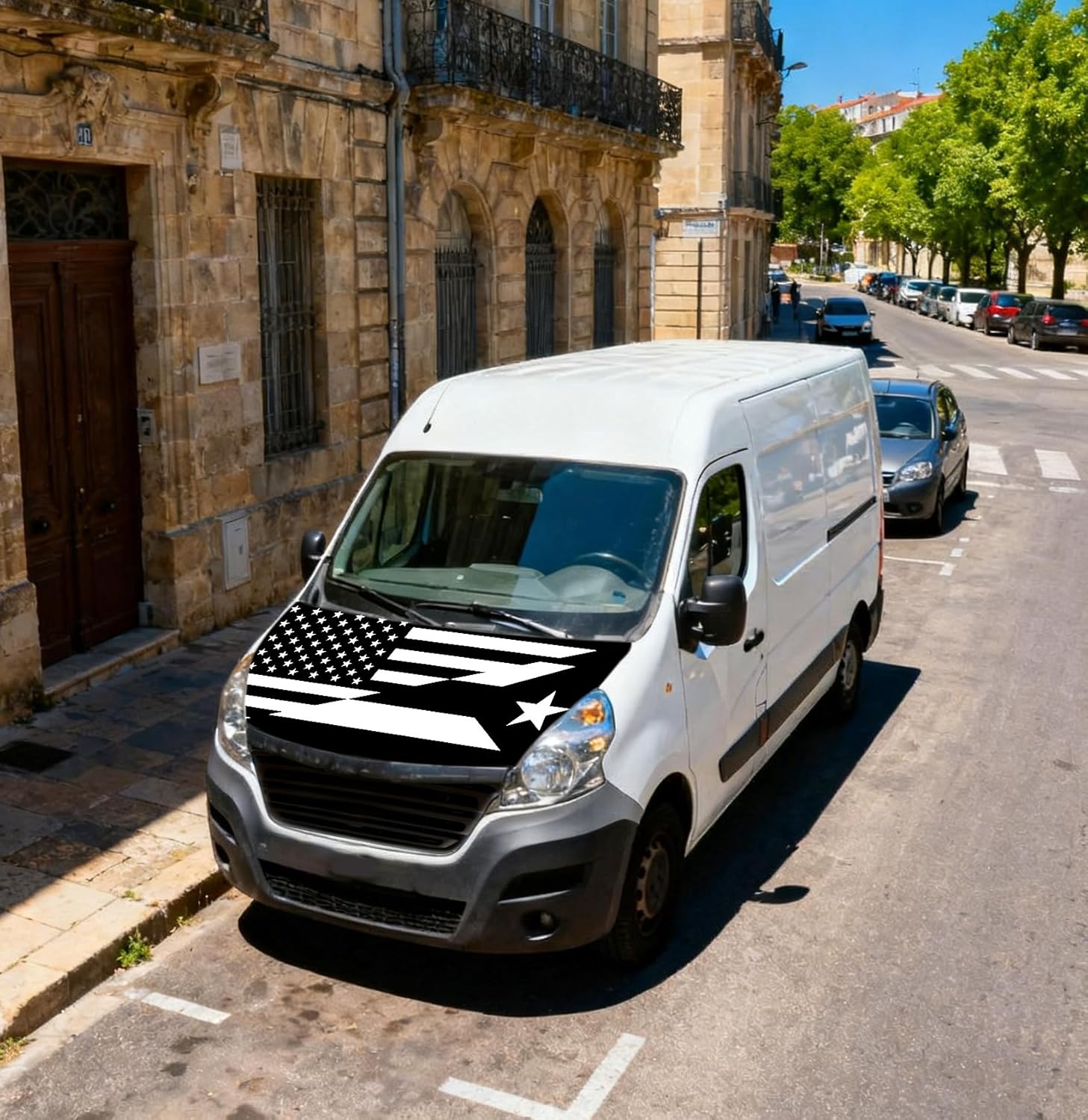 Xalvoria black and white USA Puerto Rico flag hood cover displayed on a white van parked on a city street