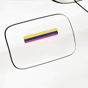 Xalvoria Colombian flag strip decal placed on a vehicle gas cap cover for a unique and stylish touch.