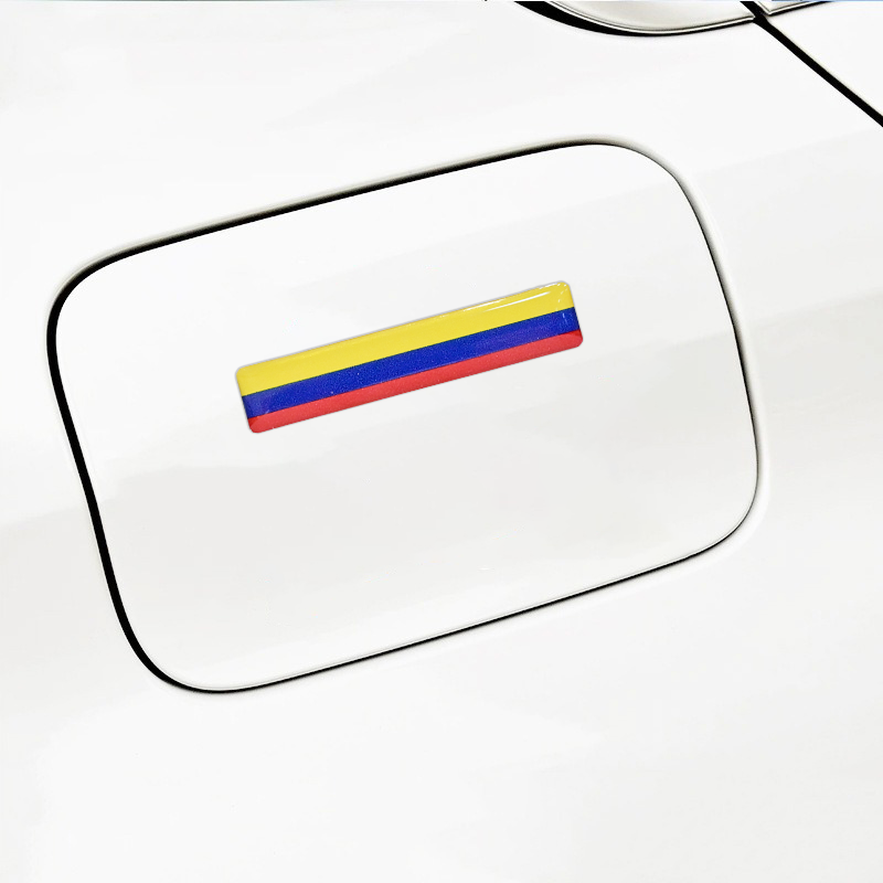 Xalvoria Colombian flag strip decal placed on a vehicle gas cap cover for a unique and stylish touch.