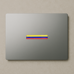 Xalvoria Colombian flag strip decal used as a minimalist laptop decoration for a clean patriotic look.