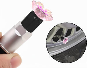 Xalvoria pink cherry blossom valve stem cap installation demonstration with close-up wheel details.