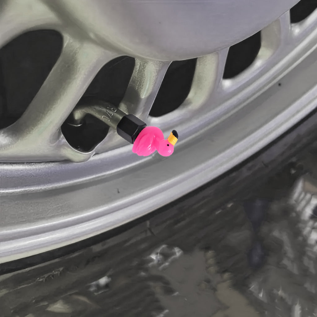 Xalvoria pink flamingo valve stem cap mounted on car wheel valve stem showing decorative topper