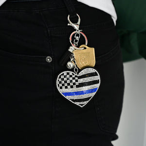 Xalvoria Thin Blue Line heart flag keychain clipped to jeans belt loop for everyday carry style