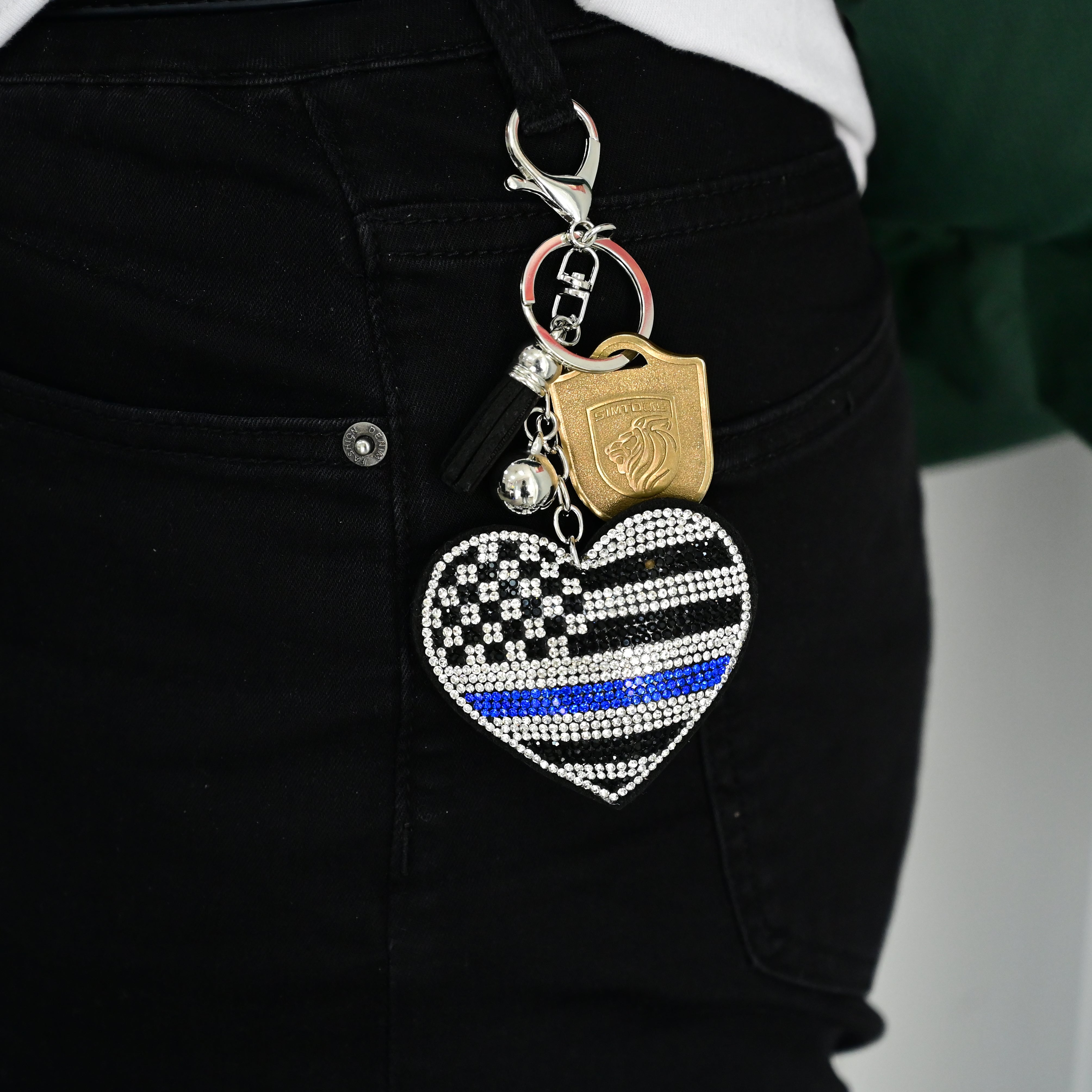 Xalvoria Thin Blue Line heart flag keychain clipped to jeans belt loop for everyday carry style