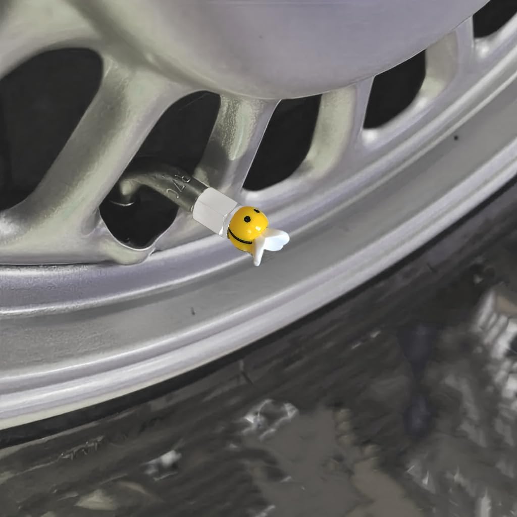 Xalvoria yellow bee valve stem cap installed on a vehicle wheel for decorative and dustproof protection.
