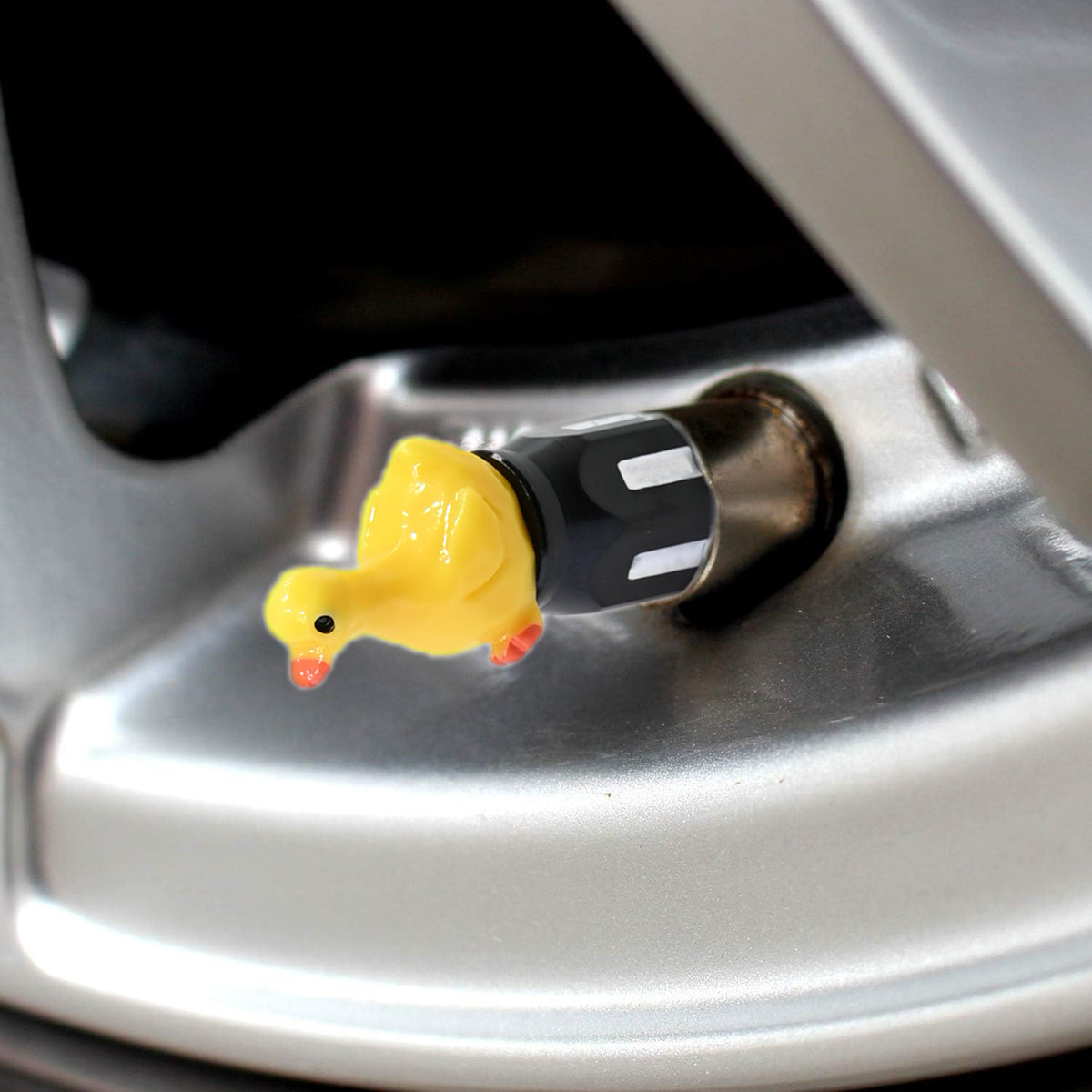 Xalvoria Yellow Goose valve stem cap installed on car wheel side view